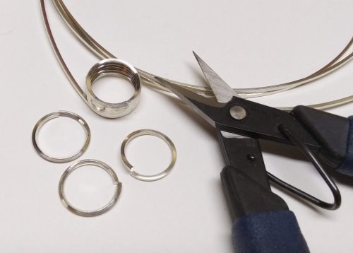 Judy Larson's Bezels Using Square Wire - , Metalwork, Cutting, Cutting Tool, Cutters, Filing, Finishing, Butane Torch, Soldering, Solder, Design, Use the Lindstrom cutter to cut the ring coil apart